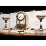 An antique French marble mantel clock with garnitu