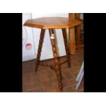 An octagonal table with parquetry top and turned l