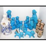A collection of turquoise glazed Dogs of Fo, a pai