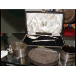 A snuff box, silver napkin rings, etc.