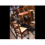 A mahogany 9ft extending dining table with brass-c