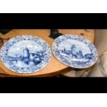 A pair of blue and white delft wall plates