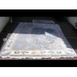 A Chinese carpet - 320cm x 242cm and a small match