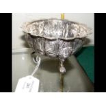 A 13cm diameter silver bowl with repousse decorati