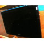 A 40 inch flat screen Samsung TV, model number UE4