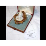 An Asprey of London oval Cameo brooch in yellow me
