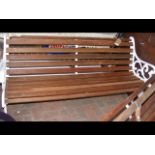 A cast iron ended bench, re-slatted in teak with b