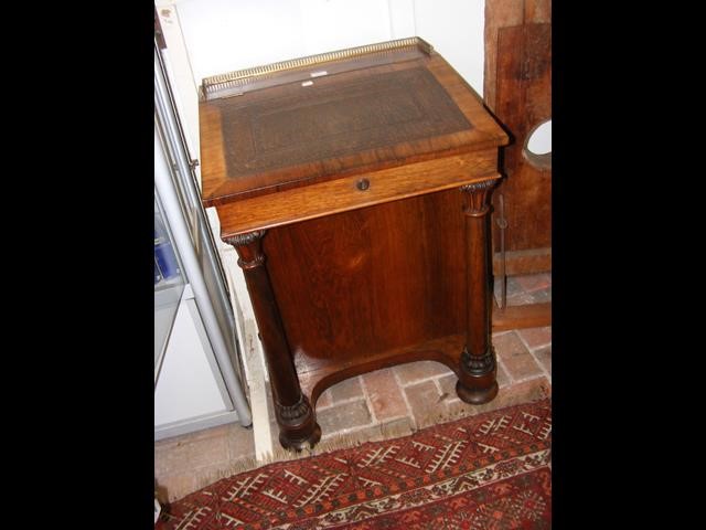 A William IV rosewood Davenport desk with brass ga