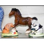 A Beswick Shire Horse, together with a Royal Doult