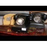 Three retro rotary-dial telephones