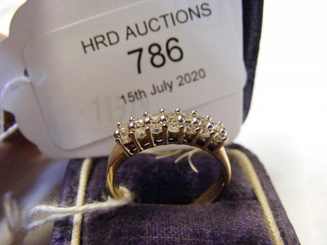 A 14 stone diamond ring in gold setting
