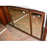 An over-mantle with triple bevelled glass panel -