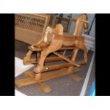 A small stripped pine rocking horse