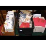 Three boxes of assorted stamps - on two shelves