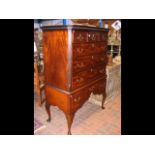 A Georgian chest on stand with decorative brass es