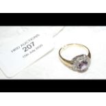 An amethyst? and diamond ring in gold setting