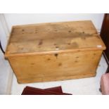 An antique stripped pine blanket chest