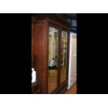 A french wardrobe with bevelled mirror doors - hei