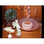 A carved jade? fish on wooden stand, together with