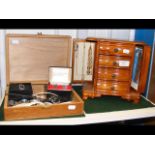 A wooden jewellery box complete with assorted cost