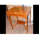 An Edwardian satin wood occasional table with parq