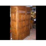 Ipswich style oak cupboard with panelled doors