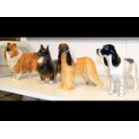 Four Beswick dogs