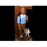 A 127cm high carved wooden figure of Tintin