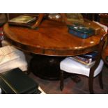 A 19th century rosewood circular dining table on s
