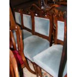 A set of four late Victorian walnut dining chairs