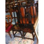 A pair of Chinese hardwood side chairs with rounde