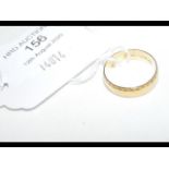 A 750 marked gold wedding band