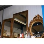 Three gilt framed wall mirrors