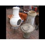 An old chimney pot, chiminea and birdbath
