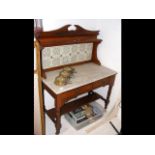 A marble top antique washstand with tiled back