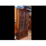 A two door oak display cabinet