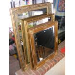 A wall mirror with gilt floral frame together with