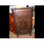 A 19th century carved oak corner cabinet - 80cm wide