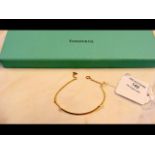 An 18ct gold Tiffany & Co. 'T Smile' bracelet in p