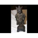 A bronze statue of Buddha with gilt remains - 22cm