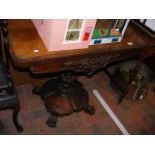 A Victorian rosewood card table on centre column -