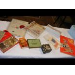 A box of ephemera, coins, cigarette cards, postcar