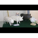 A Beswick Pig ornament, together with two others a
