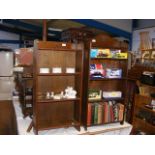 An oak three shelf bookcase together with one othe