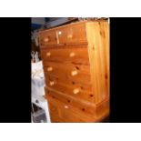 A pine chest of two short and three long drawers -