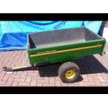 A John Deere two wheel mower cart