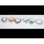 Six silver and zirconian rings - boxed