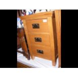 A pair of oak bedside cabinets