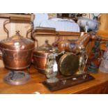 A leather horse, claret jug, dinner gong, two copp