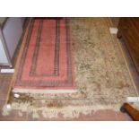 A Middle Eastern style rug, together with a small